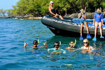a group of people swimming in a body of water