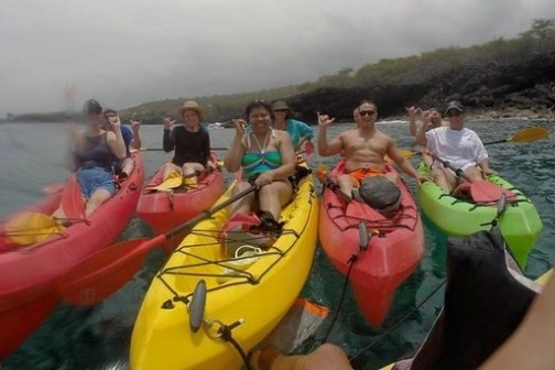 a group of people on a boat in the water