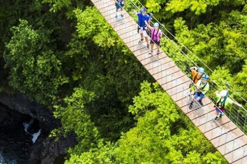 a group of people on a bridge