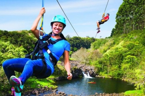 a man riding on top of a body of water