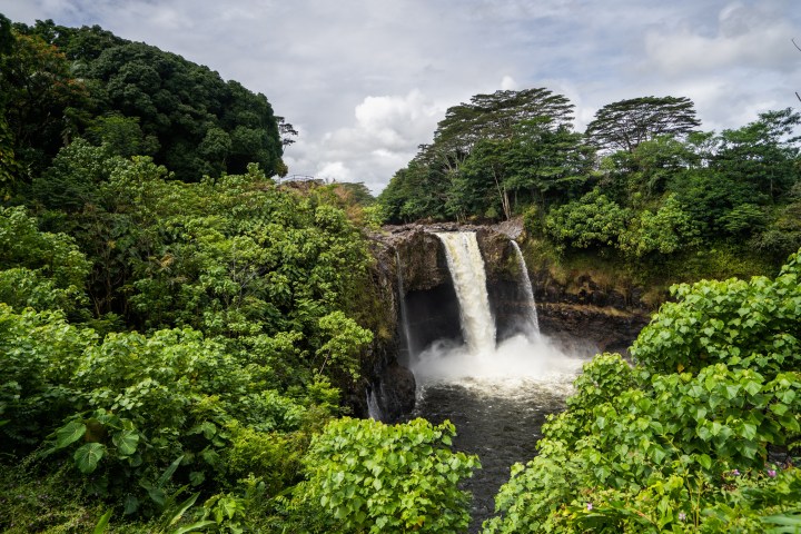 a large waterfall in a forest