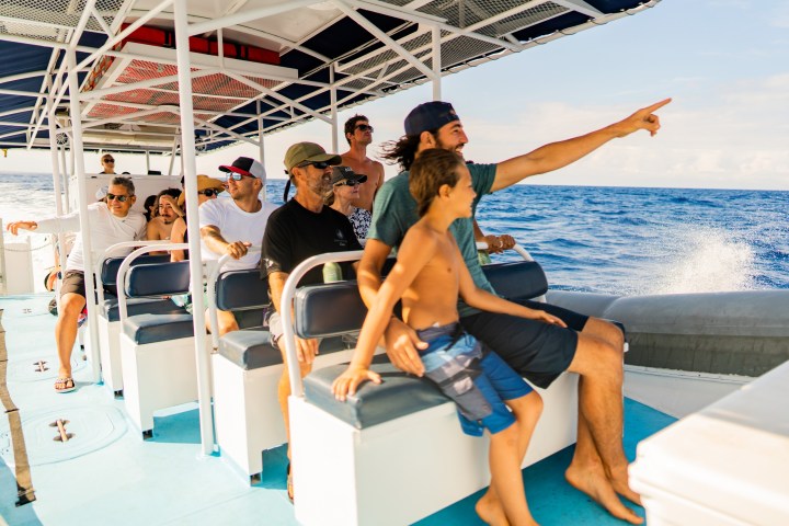 a group of people on a boat in the water